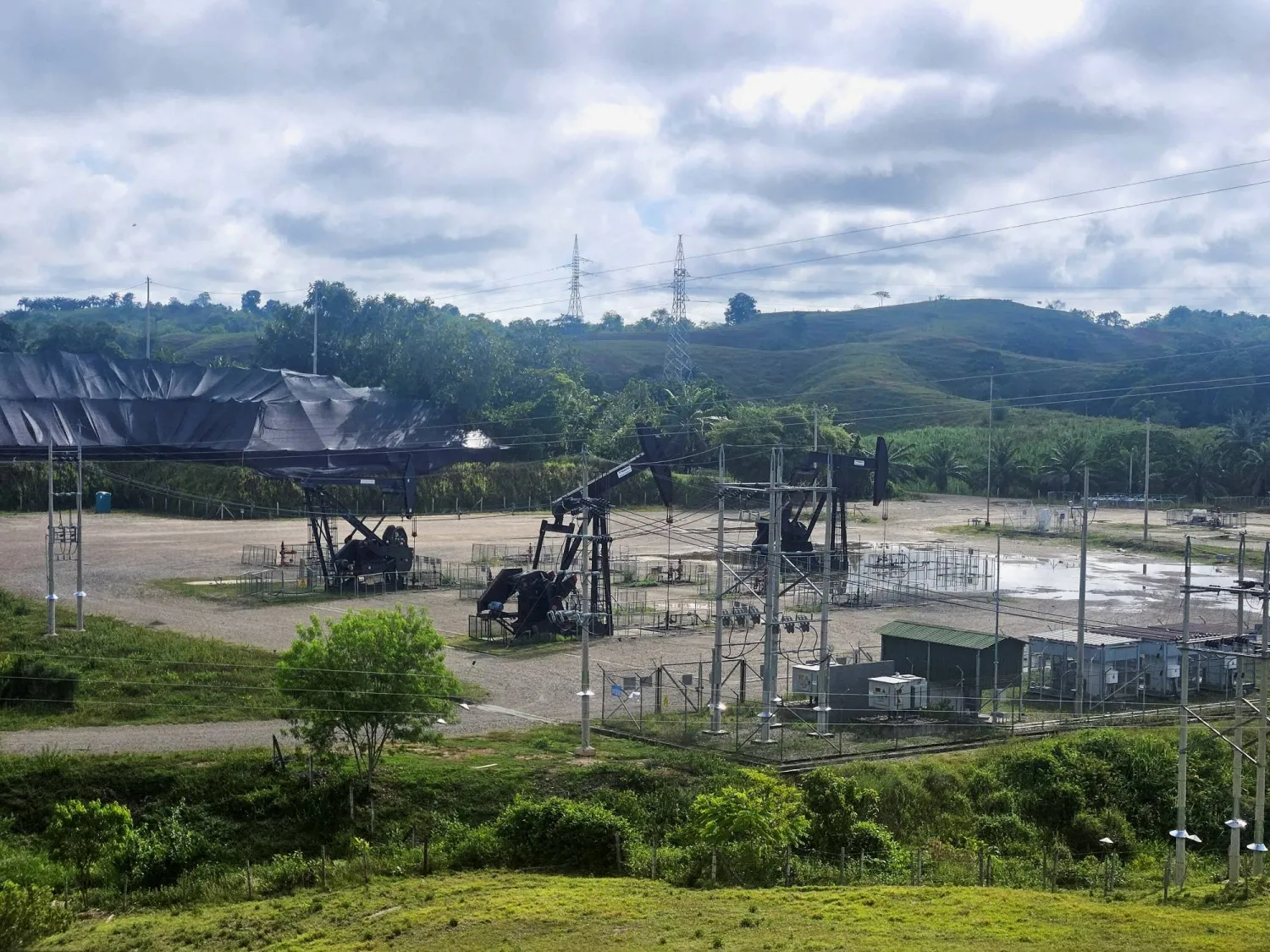 FILE PHOTO: Oil pumpjacks are pictured in an Ecopetrol oil field in Barrancabermeja, Colombia October 11, 2024. REUTERS/Nelson Bocanegra/File Photo