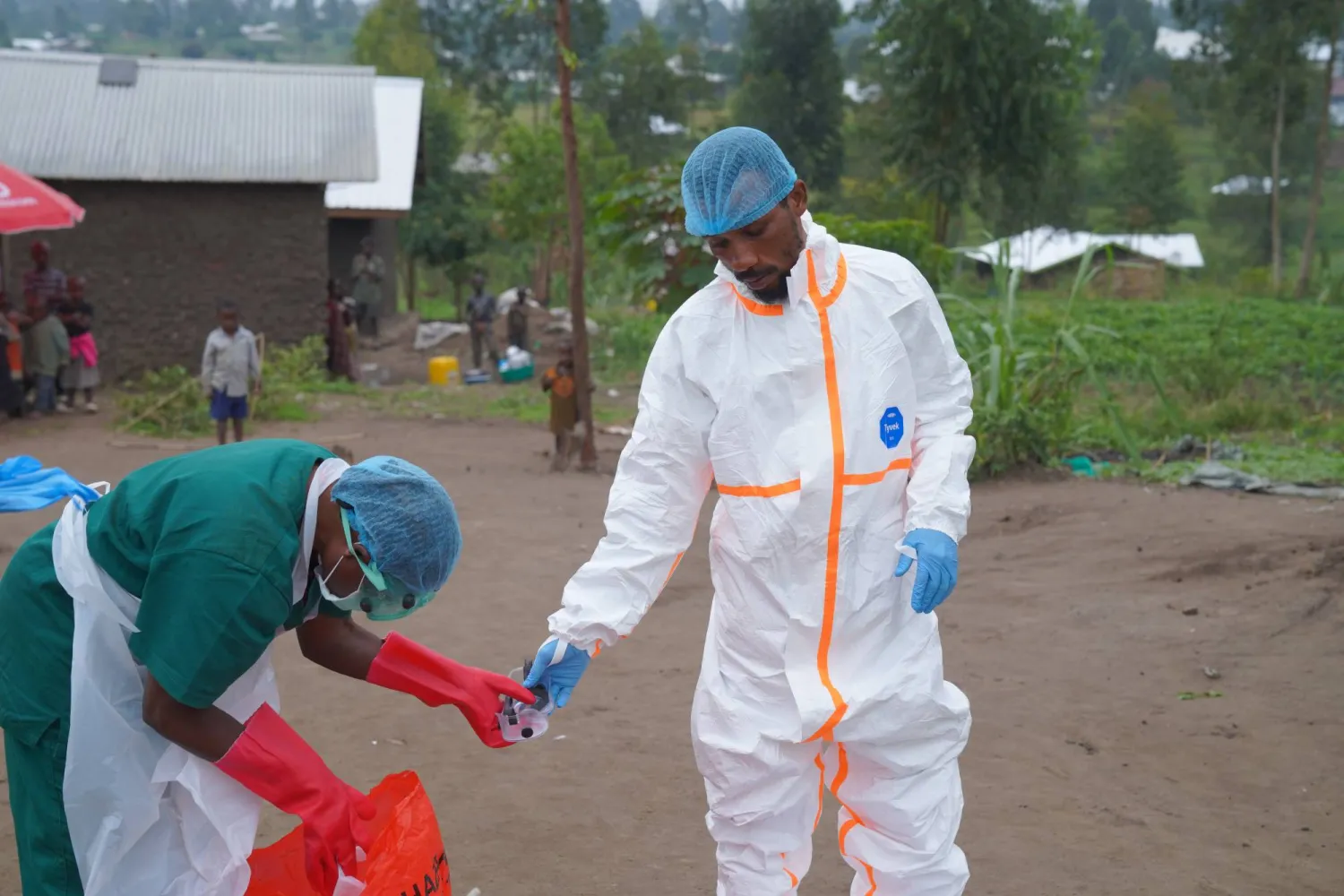  Wiza Bondele, right, a health worker on the prevention and control team, seen at work in Ituri province, eastern Congo, Wednesday, Aug 5, 2026. (AP) 