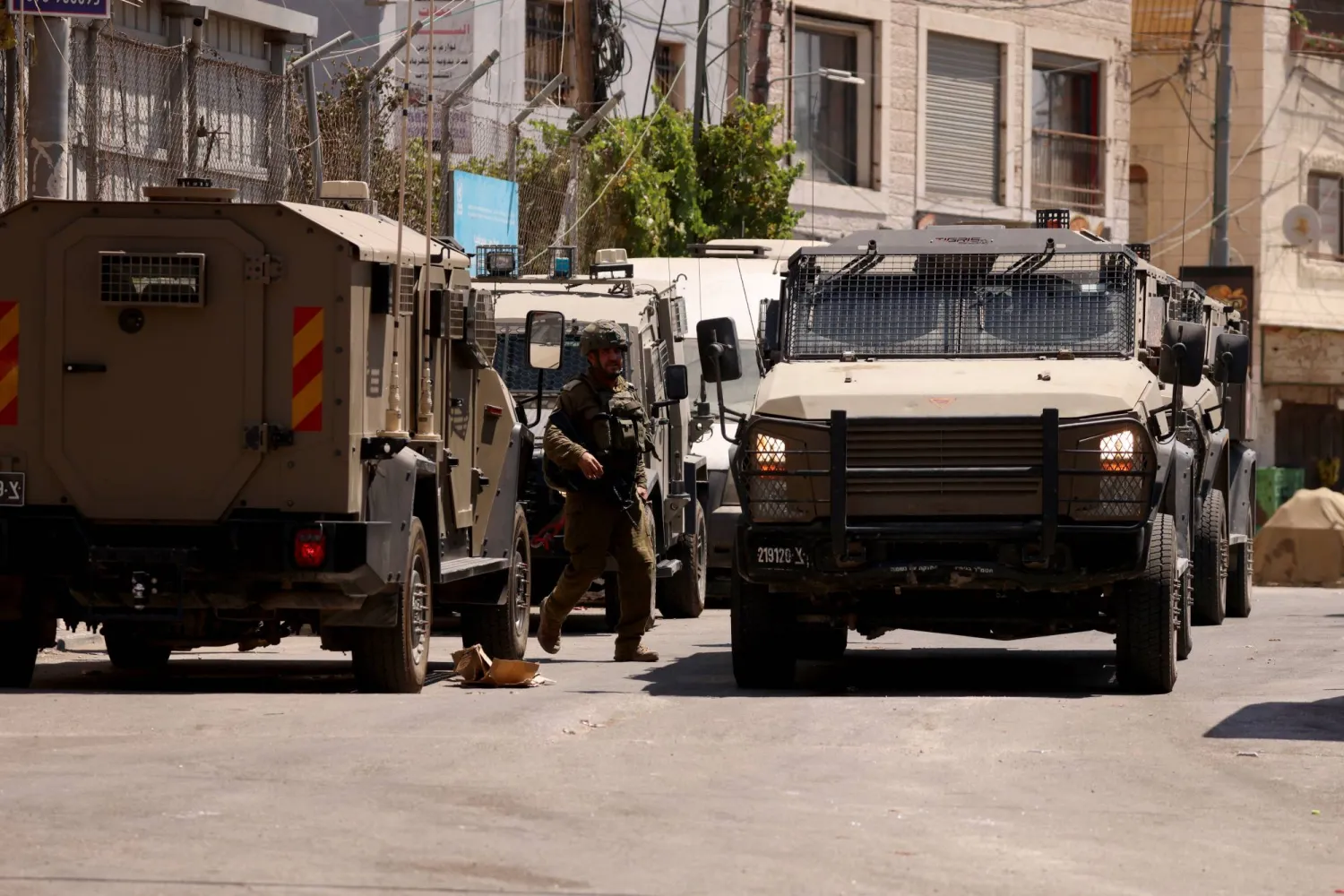 Israeli security forces patrol a street during a military operation in the Qalandia refugee camp, south of the West Bank city of Ramallah, 06 August 2026. EPA/ALAA BADARNEH