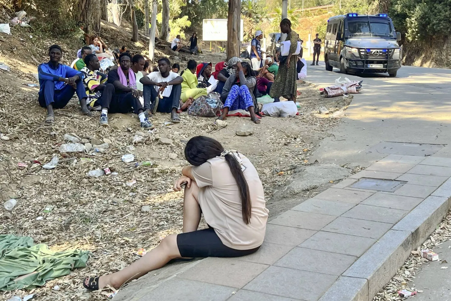 Young migrants wait to enter the Temporary Immigrant Accommodation Center (CETI) in Ceuta, Spain, 05 August 2026, after entering the Spanish enclave on 30 July during a mass crossing at the border breakwater.  EPA/Reduan