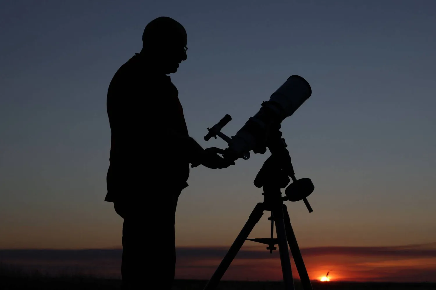 Retired shepherd and self-taught astronomer Joaquin Tapioles disassembles one of his telescopes outside the farming village of San Agustin del Pozo, Spain, July 22, 2026. REUTERS/Violeta Santos Moura