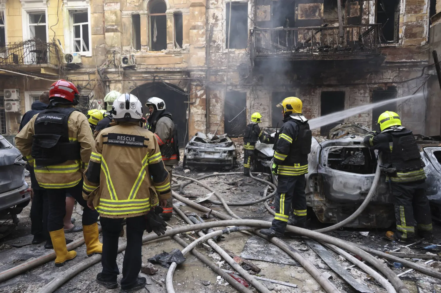 Ukrainian rescuers work at the site of a Russian strike on a residential area in downtown Odesa, Ukraine, 09 August 2026, amid the Russian invasion. EPA/IGOR MASLOV