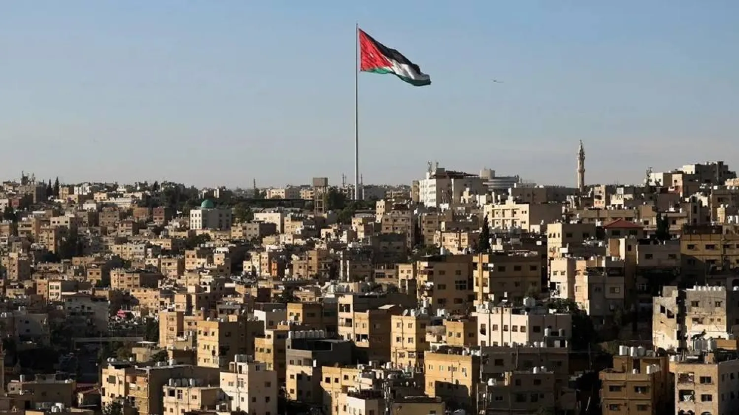 A Jordanian flag flies over the capital city, Amman, Jordan August 17, 2025. (Reuters file)