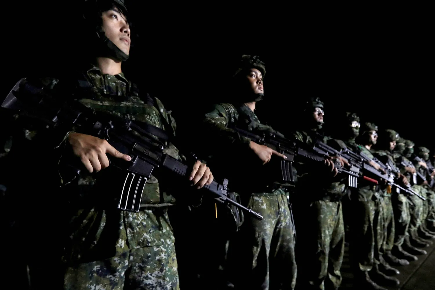 Soldiers assemble before deploying overnight from Hualien to reinforce Yilan during the annual Han Kuang military exercises in Hualien, Eastern Taiwan, late Sunday night, Aug. 9, 2026. (Reuters)