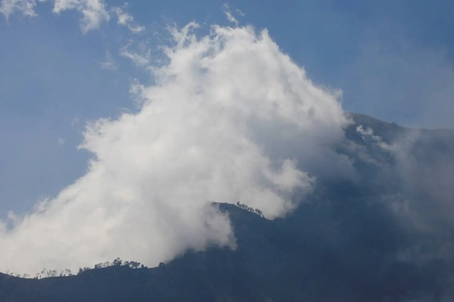 Smoke billows over an area affected by wildfire at Bromo Tengger Semeru National Park, which was closed for all tourist activities for an undetermined duration, in Probolinggo, East Java province, Indonesia, August 9, 2026. (Reuters) 
