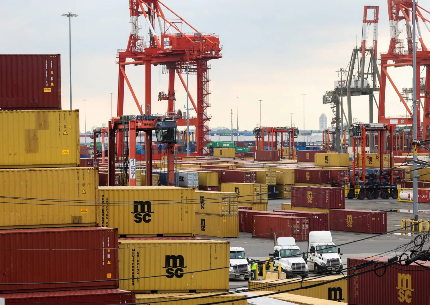 FILE PHOTO: Workers move shipping containers at the Port Authority of New York and New Jersey in, Newark, New Jersey, US, September 30, 2024. REUTERS/Caitlin Ochs/File Photo