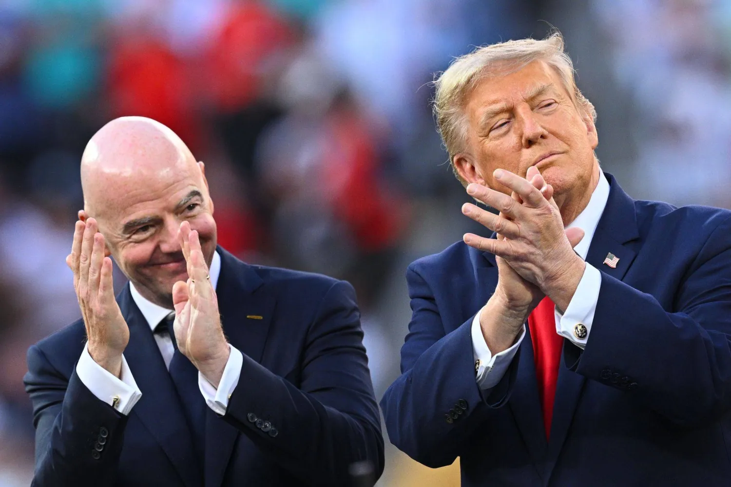 19 July 2026, US, East Rutherford: FIFA President Gianni Infantino (L) and US President Donald Trump applaud during the award ceremony of the 2026 FIFA World Cup final match between Spain and Argentina at New York-New Jersey Stadium (MetLife Stadium). (dpa) 