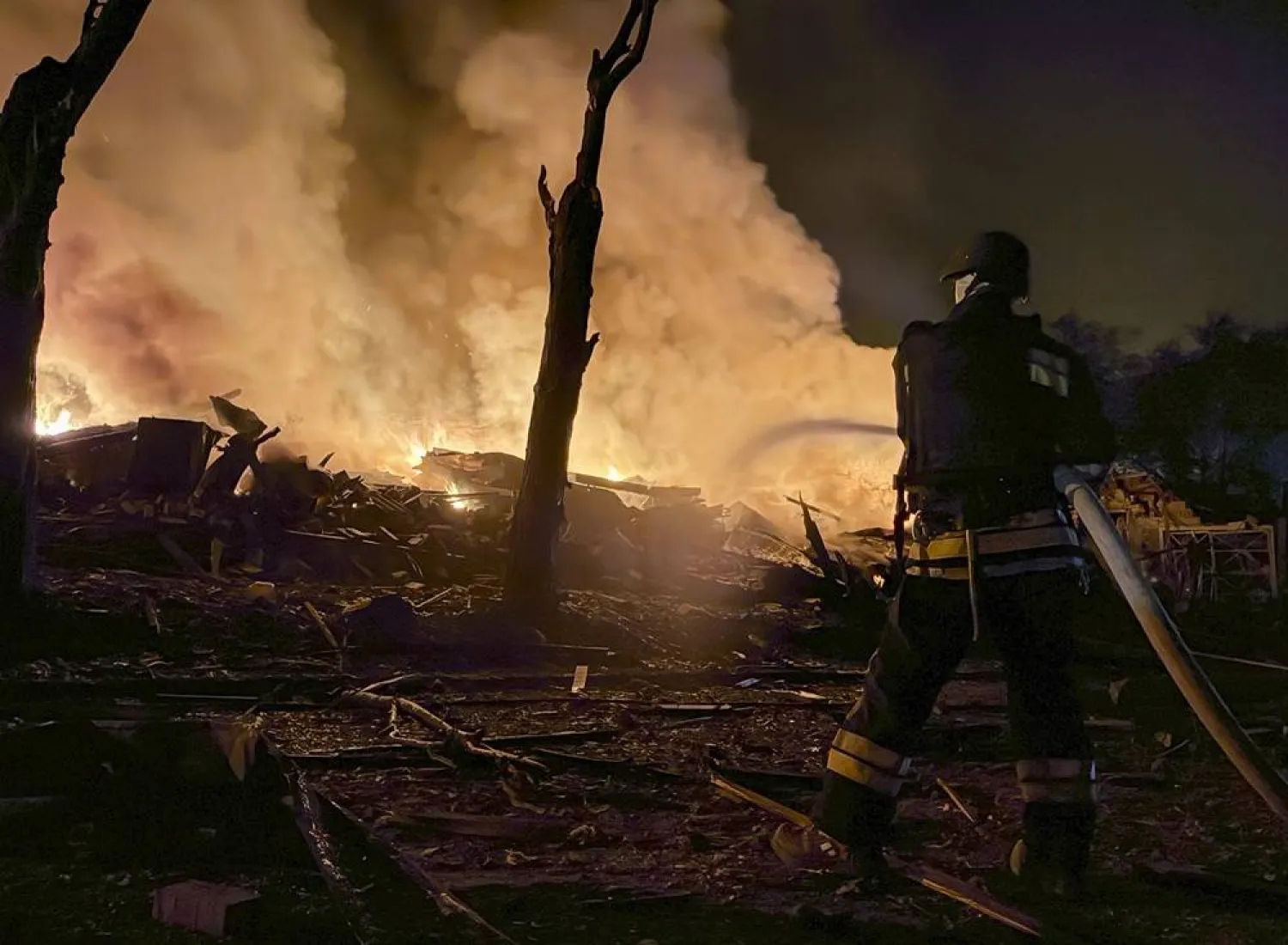 Ukrainian rescuers work at the site of a Russian attack on a residential area in Zaporizhzhia, Ukraine, 11 August 2026. (EPA)