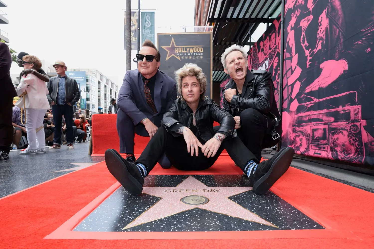 Billie Joe Armstrong, Mike Dirnt and Tre Cool from rock band Green Day pose on the day they unveil their star on the Hollywood Walk of Fame in Los Angeles, California, May 1, 2025. (Reuters)
