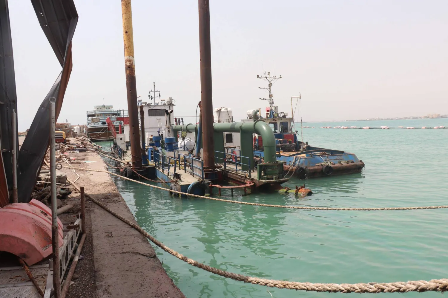 A barge is secured to the dock at the Port of Mokha the day after an attack by the Houthis on the city of Mokha, held by Yemen's internationally recognised, Aden-based government on 10 August 2026. (AFP)