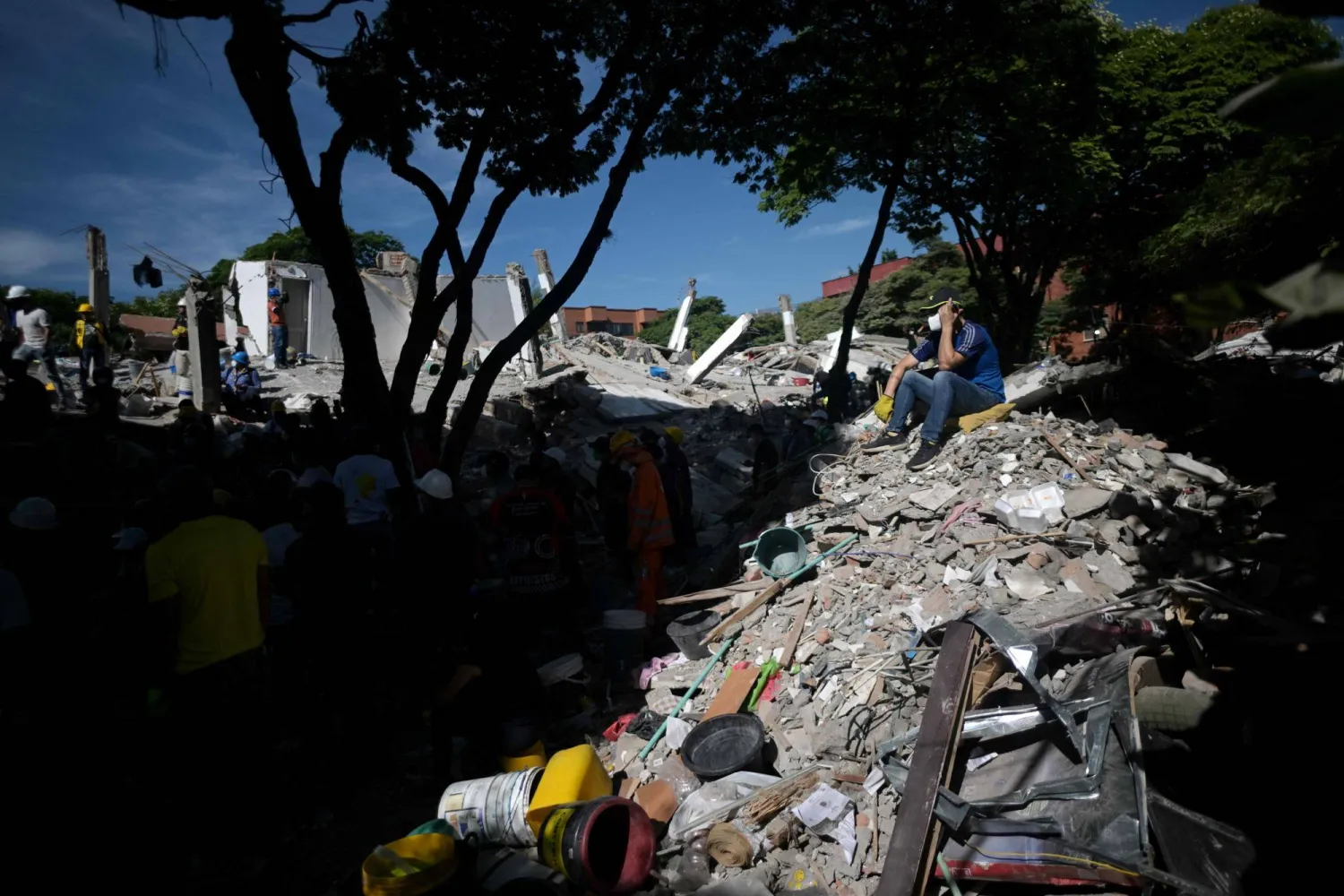  A rescuer sits on the rubble of a collapsed building after an earthquake in Cali, Colombia on August 11, 2026. (AFP)