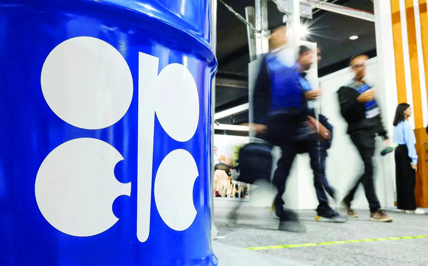 FILE PHOTO: People walk past an installation depicting barrel of oil with the logo of Organization of the Petroleum Exporting Countries (OPEC)  in Baku, Azerbaijan November 19, 2024. REUTERS/Maxim Shemetov/File Photo