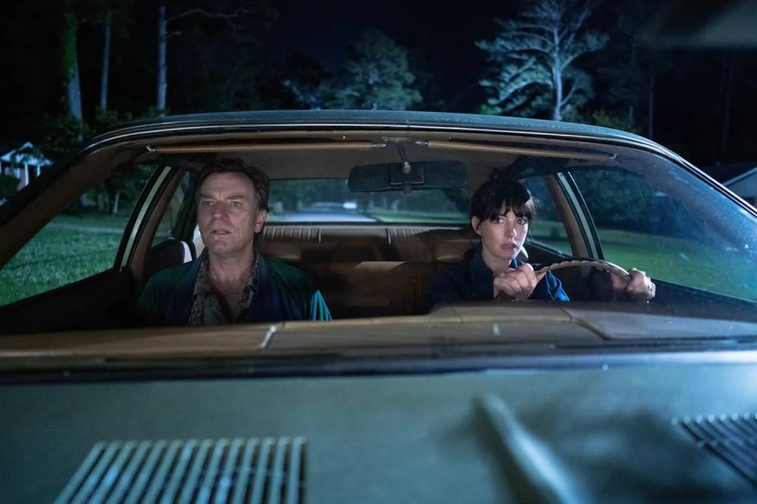  This image released by Warner Bros. Pictures shows Ewan McGregor, left, and Anne Hathaway in a scene from "The End of Oak Street." (Warner Bros. Pictures via AP) 