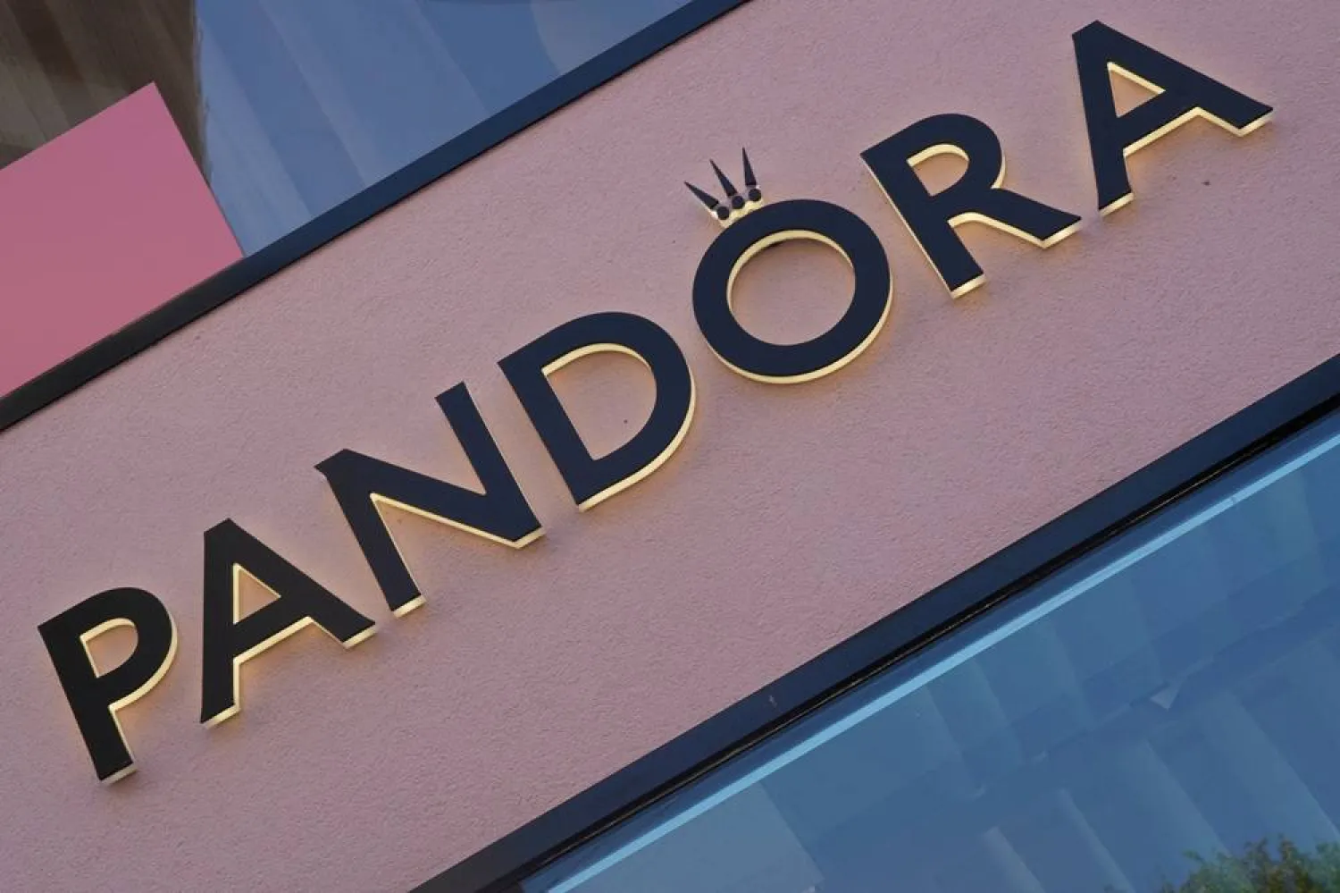 A view of the Pandora sign on one of the branches of the Danish jewellery maker Pandora in central Copenhagen, Denmark, August 13, 2025. (Reuters) 