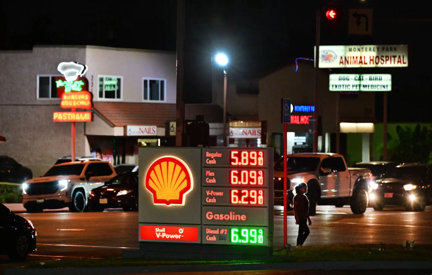 Gas prices are seen listed as motorists make their way durig the evening commute in Monterey Park, California, on August 13, 2026. (Photo by Frederic J. BROWN / AFP)