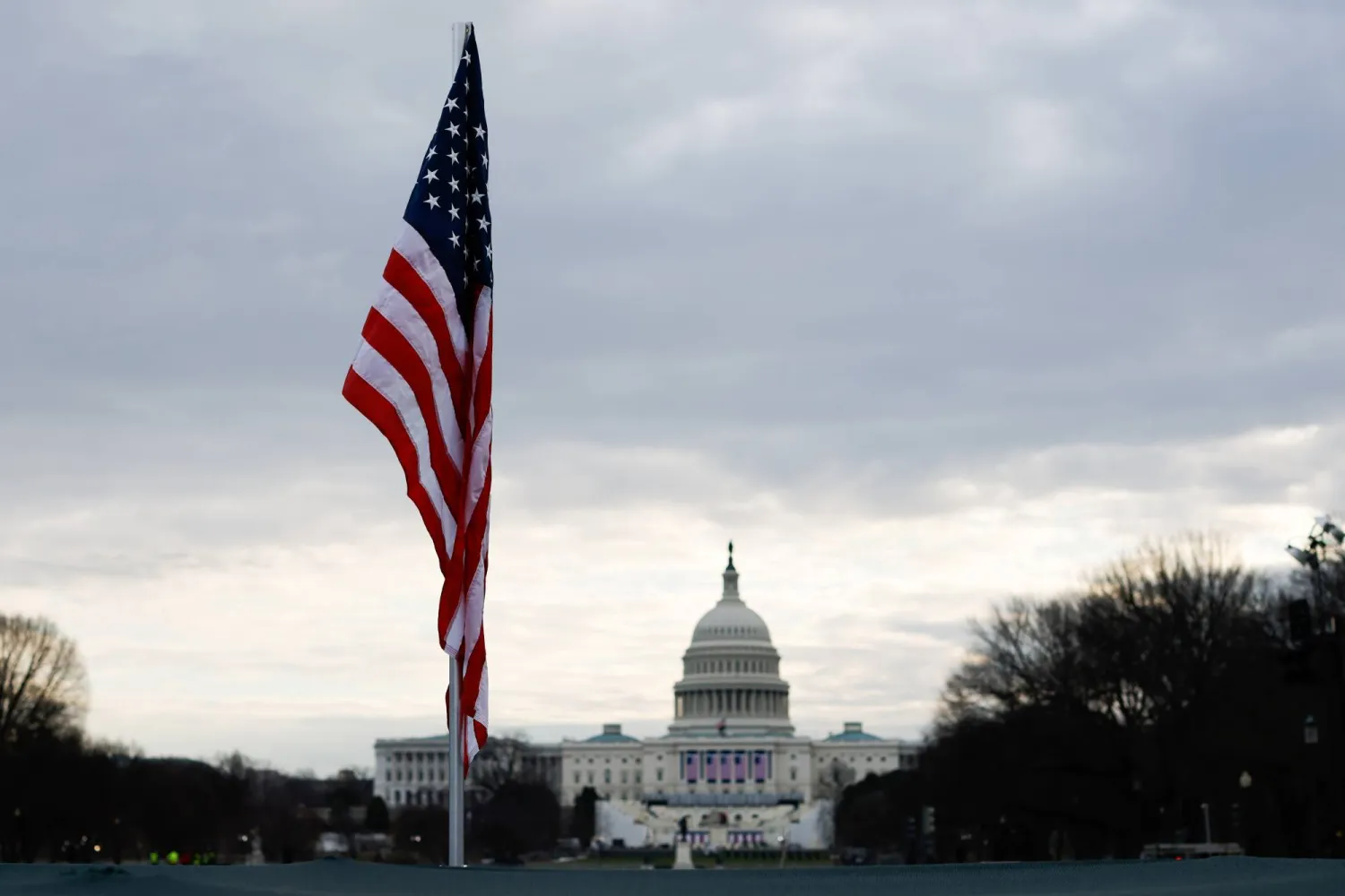The American flag flies in the National Mall near the Capitol building in Washington (Reuters)