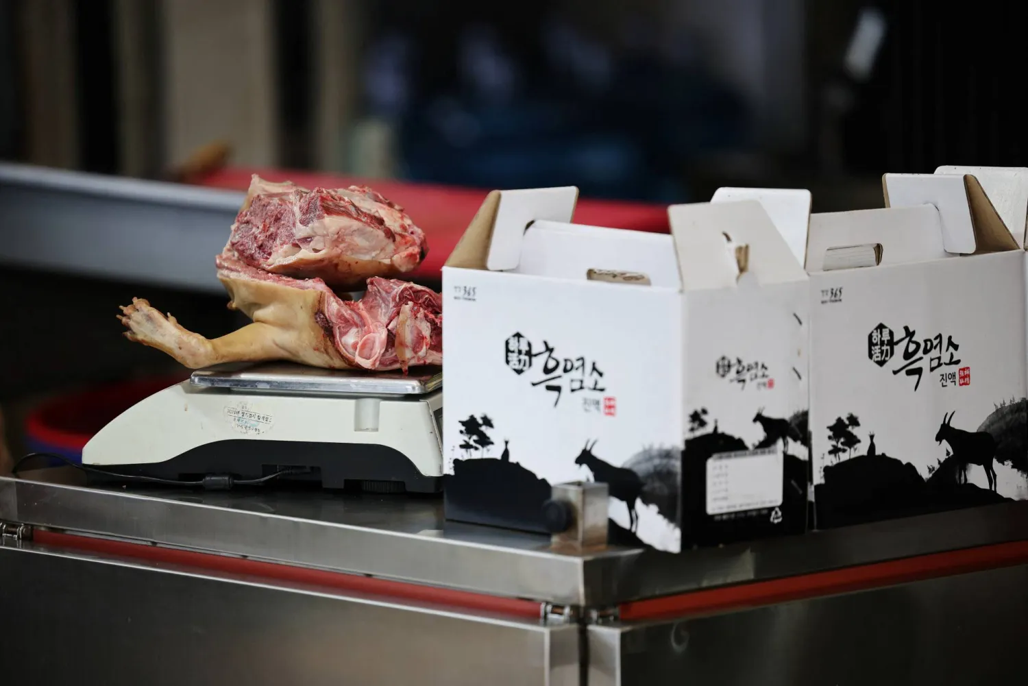 Dog meat placed on a scale during Malbok, the last of Korea's traditional hottest days of summer, at a restaurant selling dog meat and black goat meat stews in Seongnam, South Korea, August 14, 2026.   REUTERS/Kim Hong-Ji
