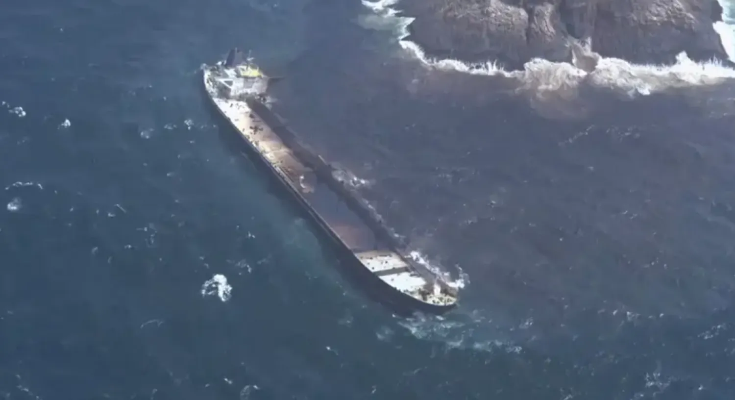 Aerial view of oil spilling from the oil tanker Caroline Bezengi into the water, off Al-Qibliyyah island, Hallaniyat Group Of Islands, Oman, August 13, 2026, in this still image taken from a handout video. (Reuters)
