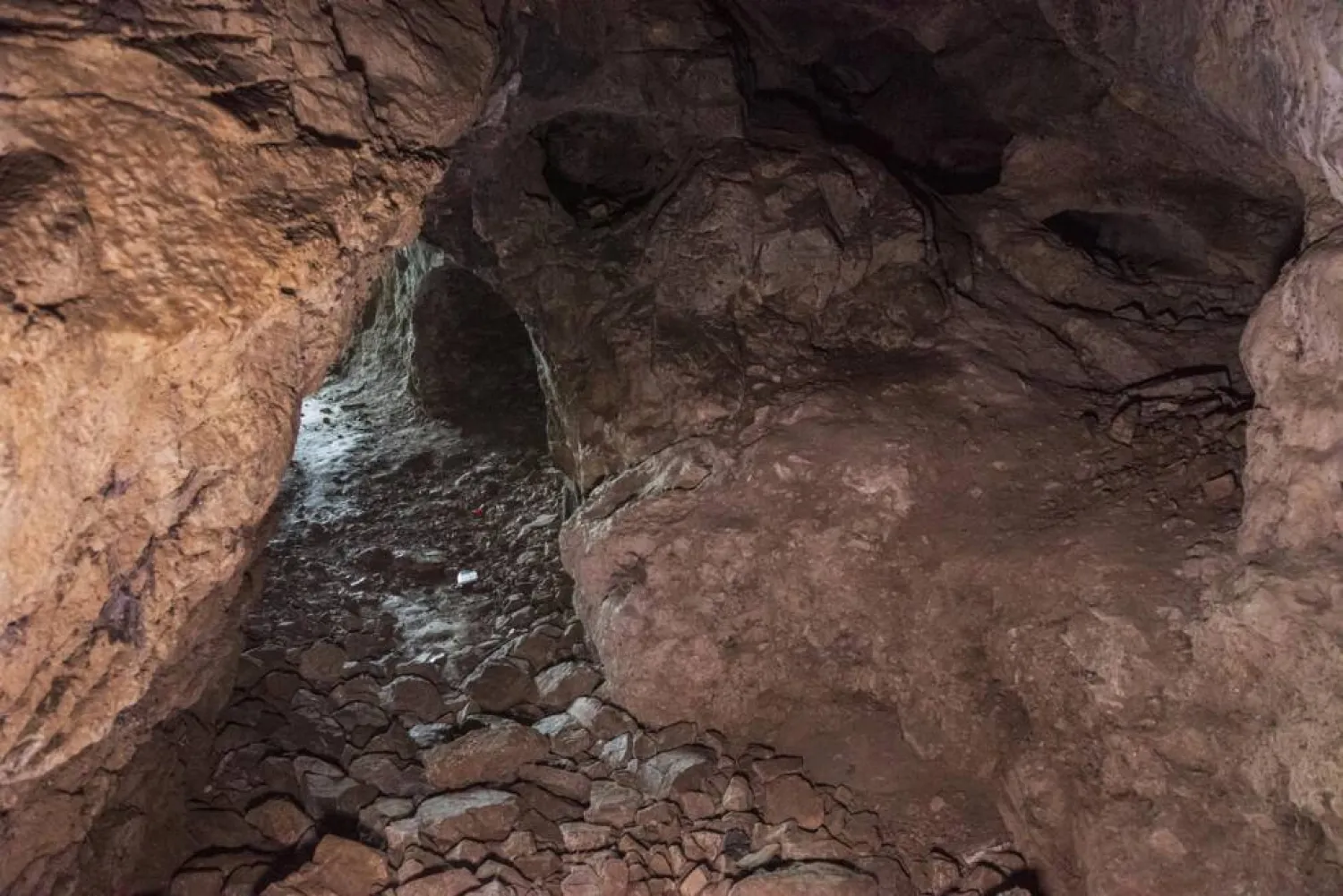 Access to the rock-strewn cave is not easy. Ahmet Ayberk Cimen / AFP
