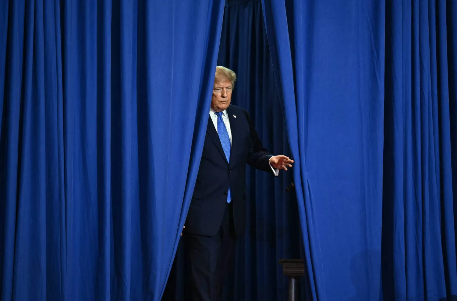 US President Donald Trump arrives to deliver remarks at the Nassau County Police Academy Center for Training and Intelligence in Garden City, New York, on August 14, 2026. (Photo by Kent NISHIMURA / AFP)