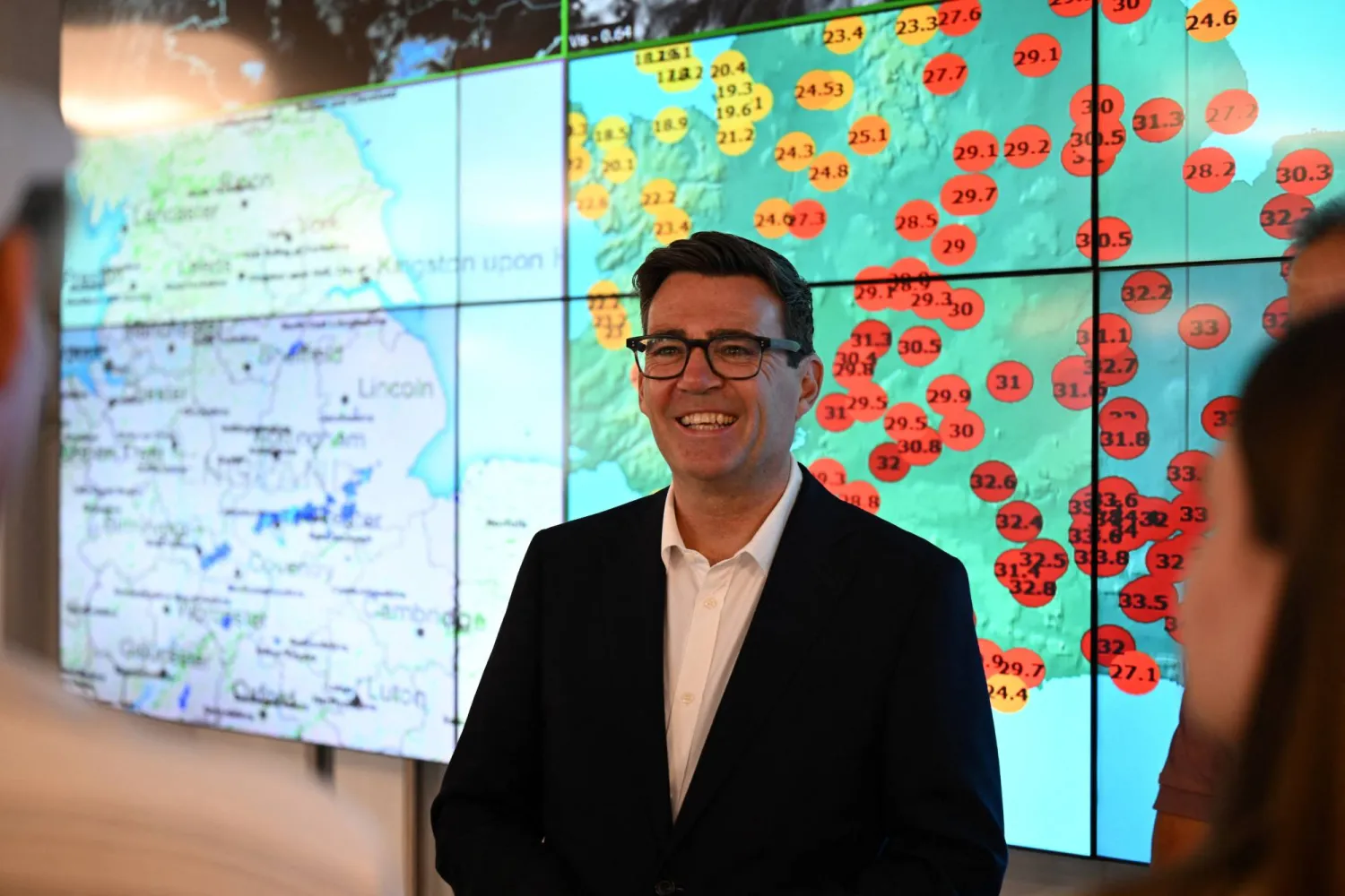 Prime Minister Andy Burnham speaks with apprentices and staff at the met office during a visit on August 14, 2026 in Exeter, United Kingdom. (Reuters)