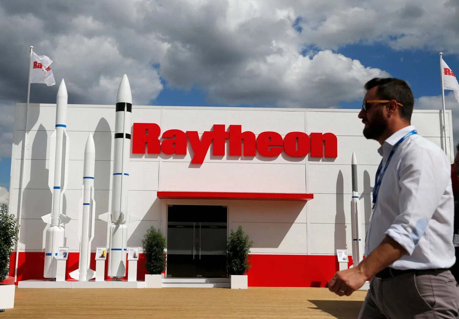 A visitor walks past Raytheon stand at the 53rd International Paris Air Show at Le Bourget Airport near Paris, France June 21, 2019. (Reuters)