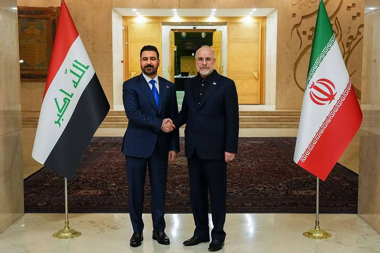 الزيدي وقاليباف خلال لقائهما في طهران الشهر الماضي (أ.ف.ب)