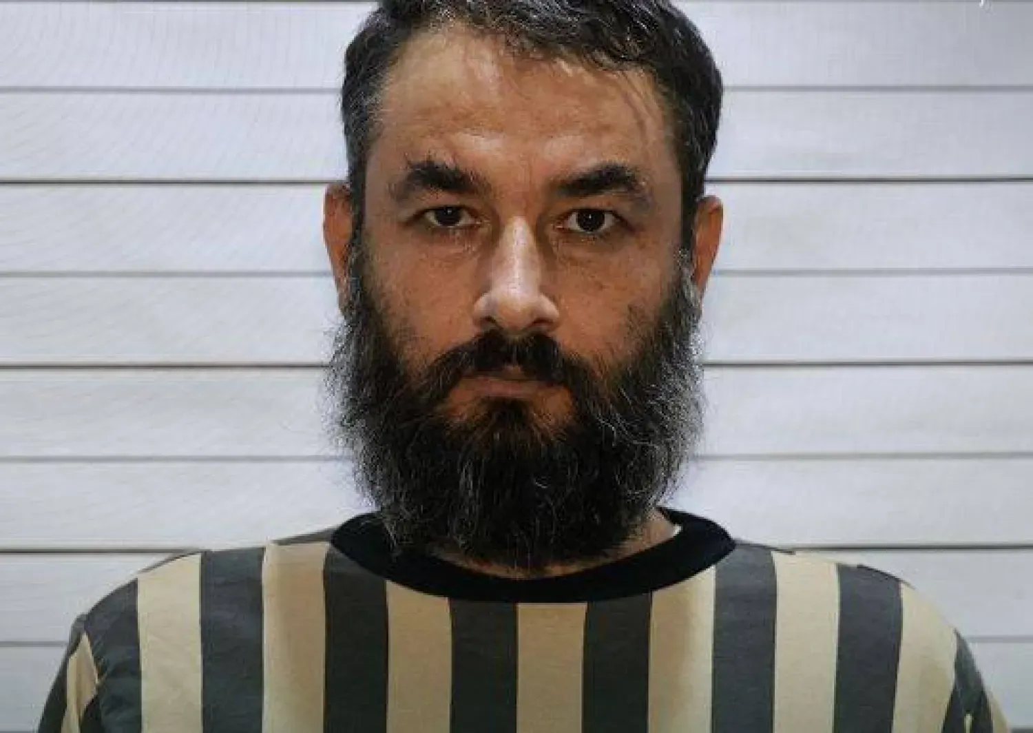 DEAŞ'ın üst düzey askeri liderlerinden, "Ebu Cihad el-Muhacir" lakaplı Hamza Abdullah Muhammed, yakalandıktan sonra (SANA) 