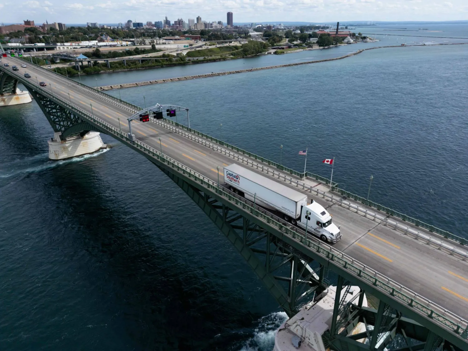 This aerial view shows a Capital Southern Transportation, Inc. truck passing over the Peace Bridge between Canada and the US in Fort Erie, Ontario, on August 18, 2026. (AFP)