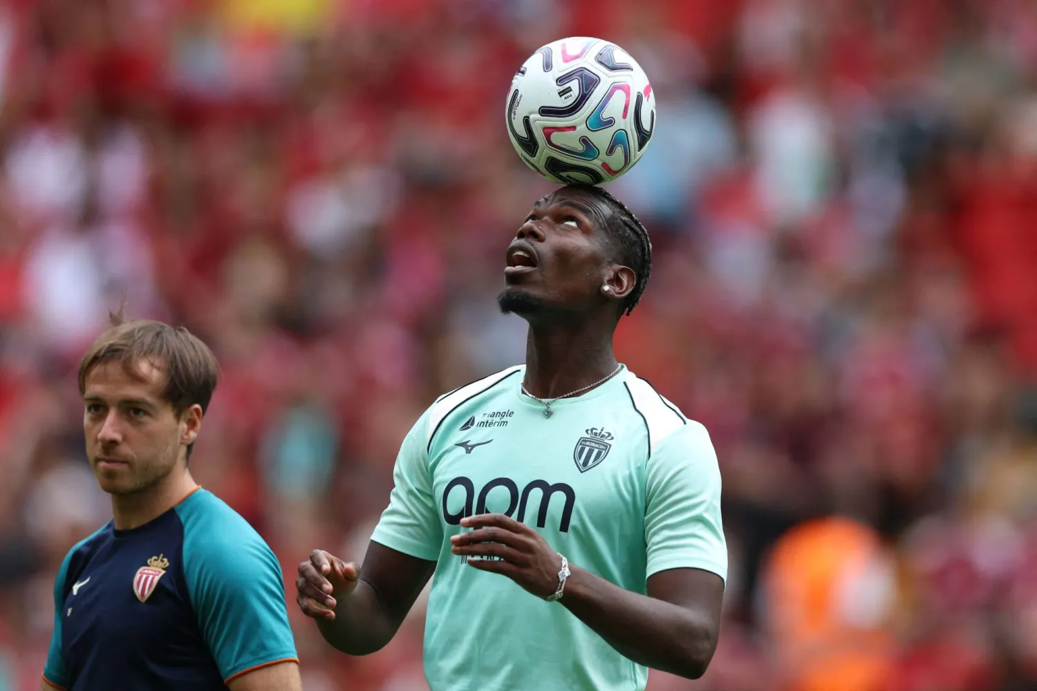 Monaco's French midfielder #08 Paul Pogba on the pitch ahead of the pre-season friendly football match between Liverpool and Monaco at Anfield in Liverpool, north west England on August 9, 2026. (Photo by Darren Staples / AFP)