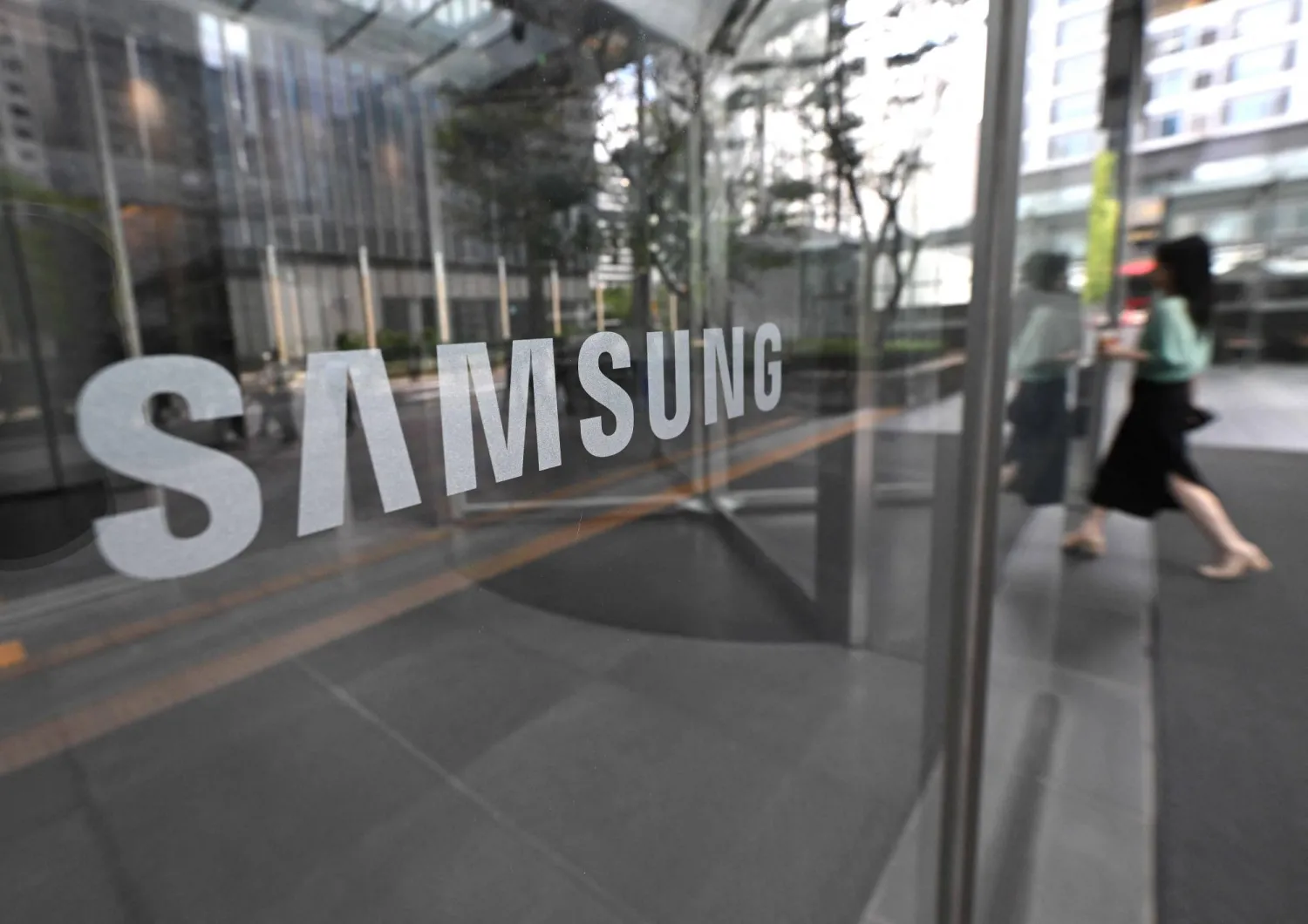 The logo of Samsung is seen at the Samsung Electronics Seocho building in Seoul on July 30, 2026. (Photo by Jung Yeon-je / AFP)