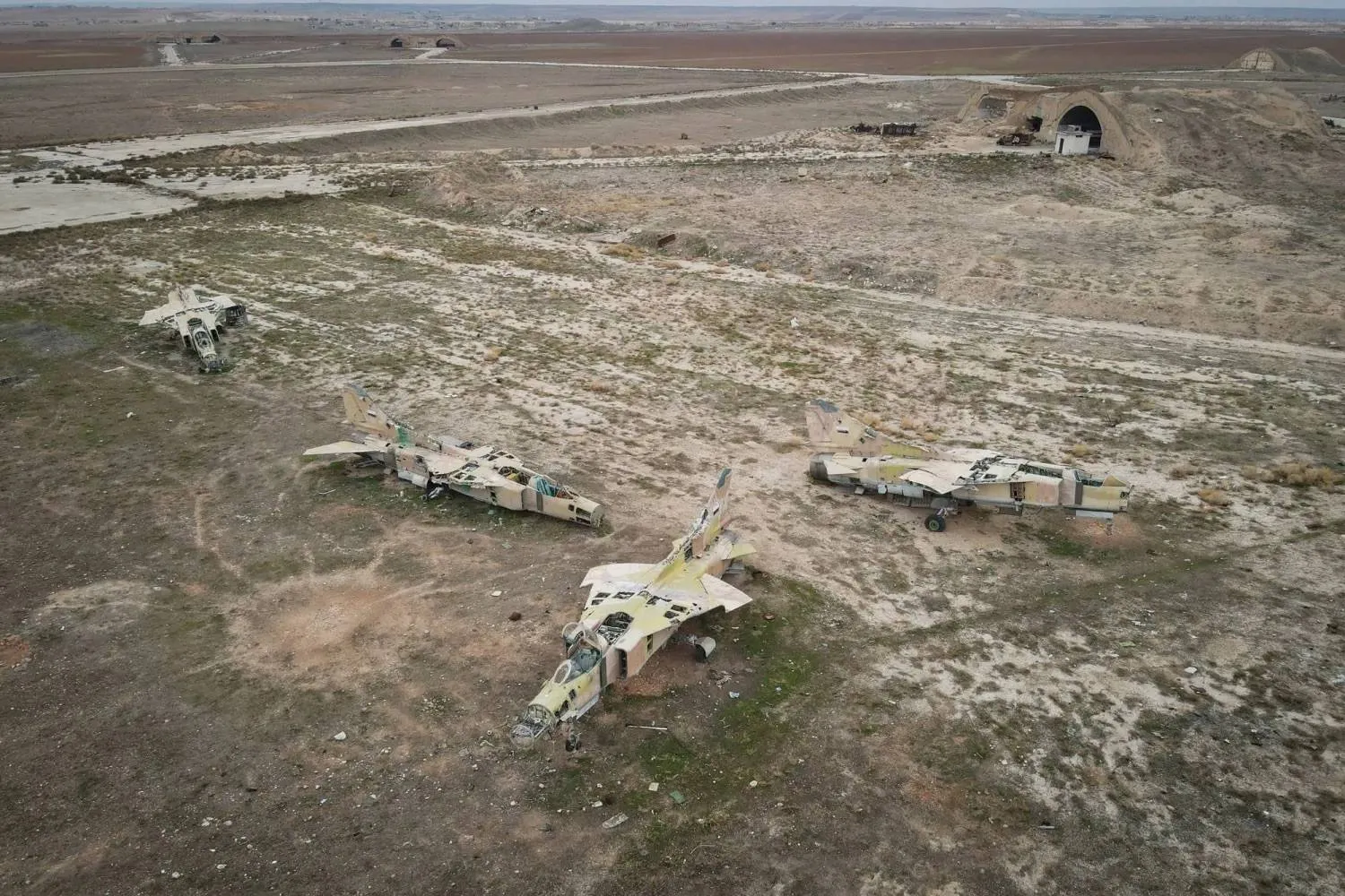 Out-of-service Syrian Air Force aircraft at the Abu al-Duhur military air base, east of Idlib, after Syrian opposition fighters seized the area on Dec. 7, 2024 (EPA) 