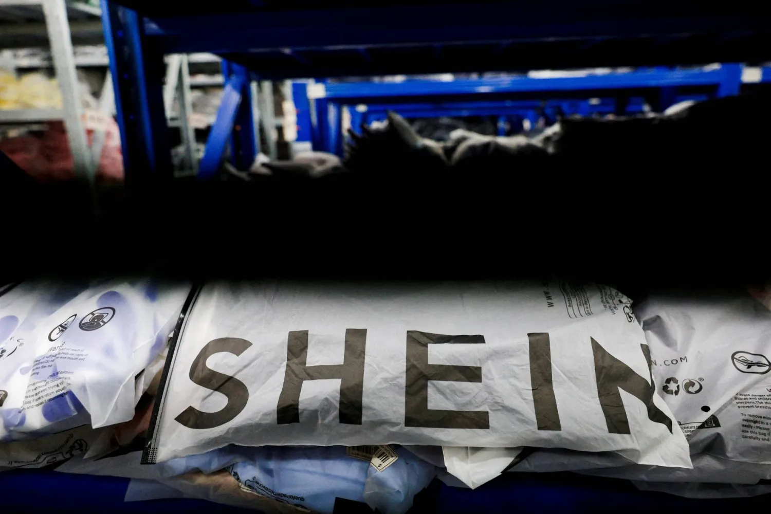 FILE PHOTO: Packs of clothing are displayed at a garment factory for Shein in Panyu District, Guangzhou, Guangdong province, China, July 27, 2026. REUTERS/Go Nakamura/File Photo