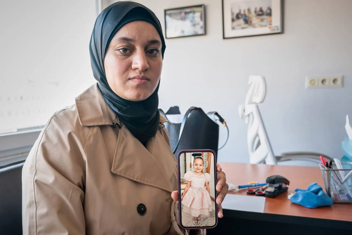 Wesam Hamada, the mother of Hind Rajab shows a picture of her late daughter during an interview with The Associated Press at an undisclosed location, Friday, Aug. 21, 2026. (AP)