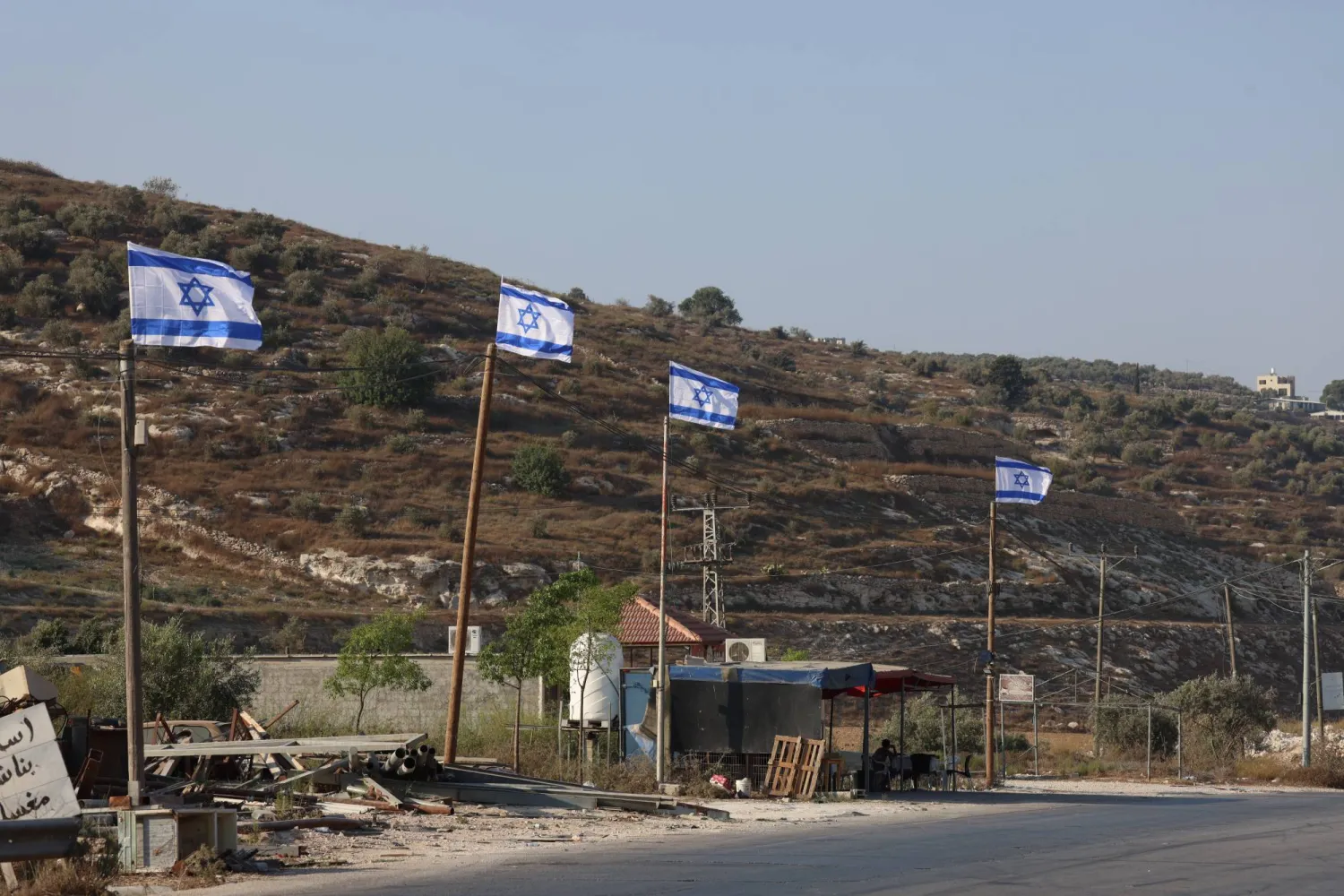  Israeli flags raised by settlers as seen on a main road to Jenin City, 21 August 2026. (EPA)