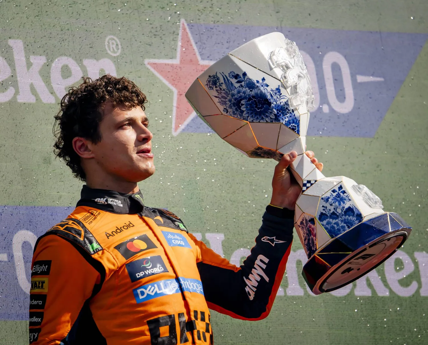 First placed McLaren driver Lando Norris of Britain celebrates with the trophy on the podium after the Formula 1 Dutch Grand Prix at the Circuit Zandvoort racetrack in Zandvoort, Netherlands, 23 August 2026.  EPA/Sem van der Wal