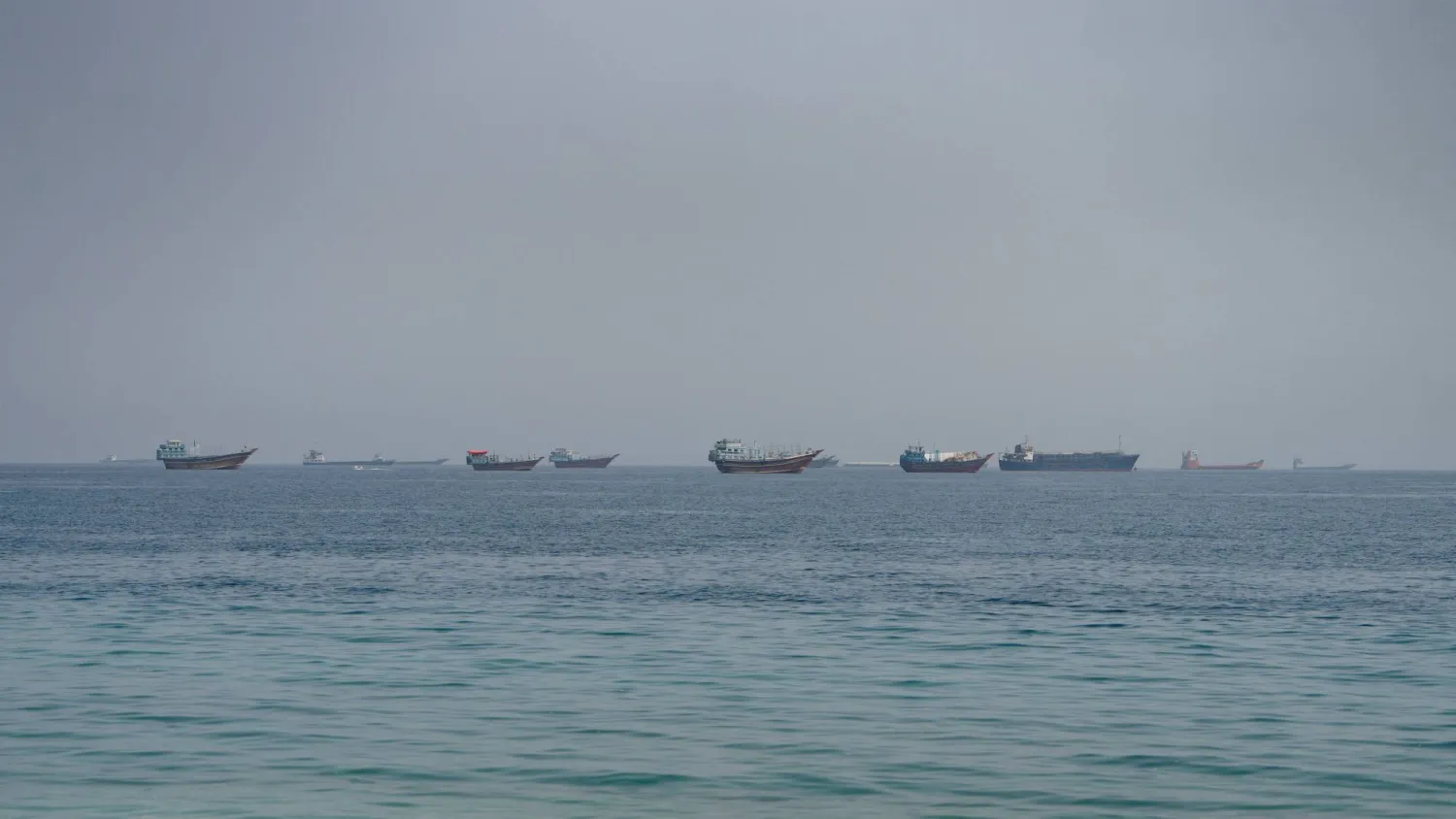 Vessels near the Strait of Hormuz, as seen from Musandam, Oman, August 24, 2026. REUTERS/Stringer