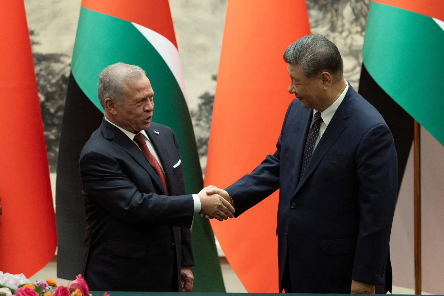 China's President Xi Jinping, right, and King Abdullah II of Jordan shake hands after a signing ceremony at the Great Hall of the People in Beijing, Monday, Aug. 24, 2026. (Andres Martinez Casares/Pool Photo via AP)
