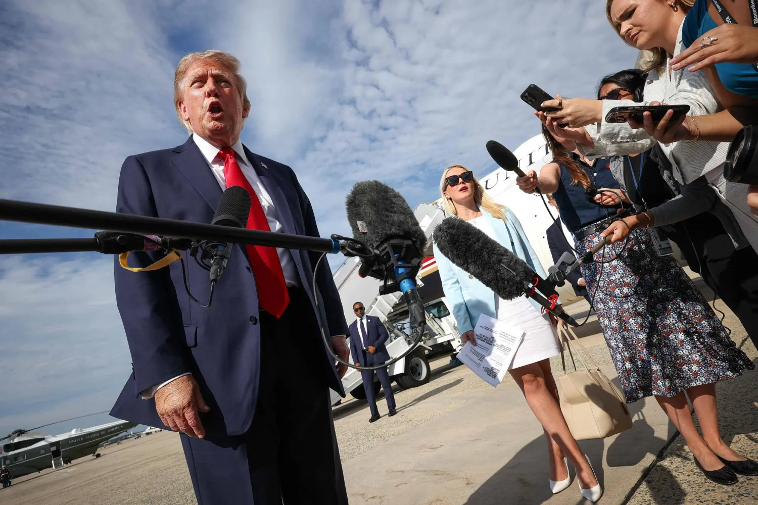 JOINT BASE ANDREWS, MARYLAND - AUGUST 21: US President Donald Trump speaks with reporters before boarding Air Force One on August 21, 2026 in Joint Base Andrews, Maryland. Win McNamee/Getty Images/AFP
