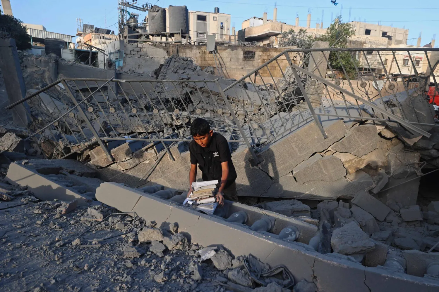 A Palestinian inspects the old Abu Salim mosque a day after it was hit by an Israeli airstrike in Deir al-Balah in the central Gaza Strip on August 25, 2026. (AFP)