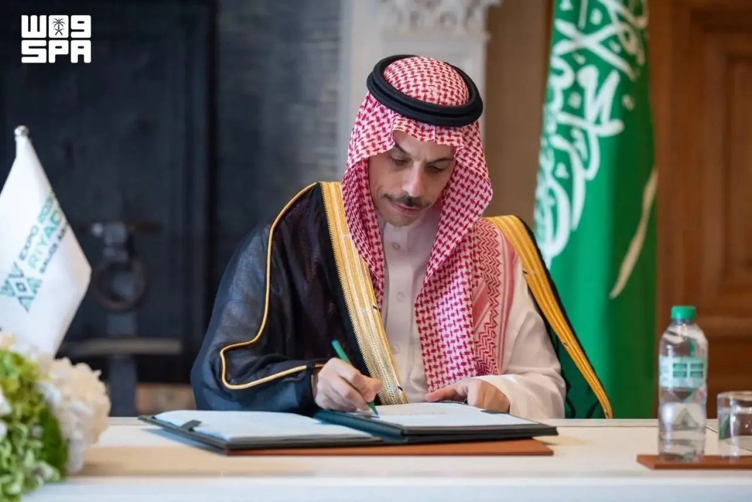 Saudi Minister of Foreign Affairs Prince Faisal bin Farhan bin Abdullah signs the agreement. (SPA)