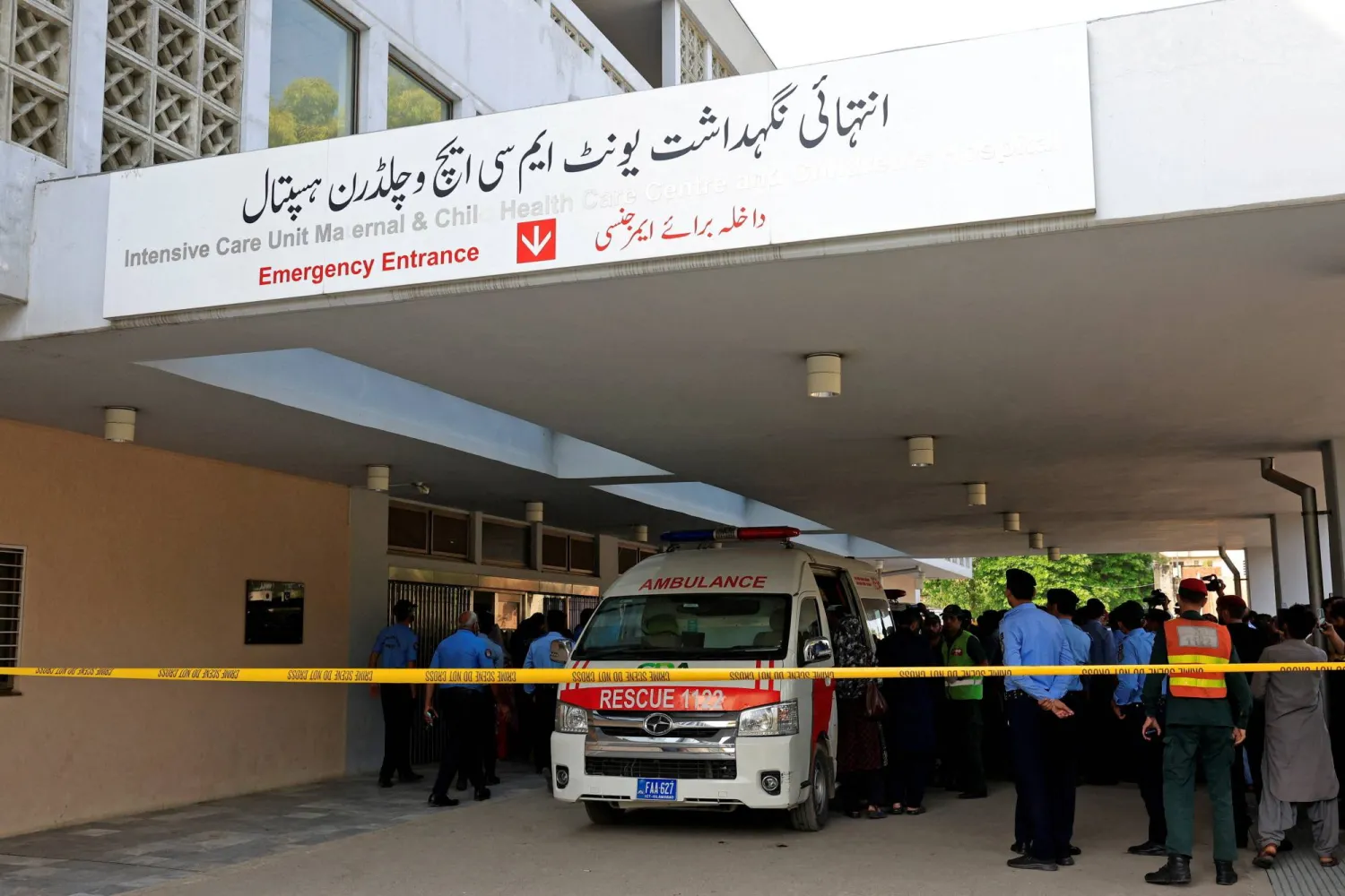 Police officers move past an ambulance outside an intensive care unit after a fire broke out at the Pakistan Institute of Medical Sciences (PIMS) hospital in Islamabad, Pakistan, August 26, 2026. (Reuters)