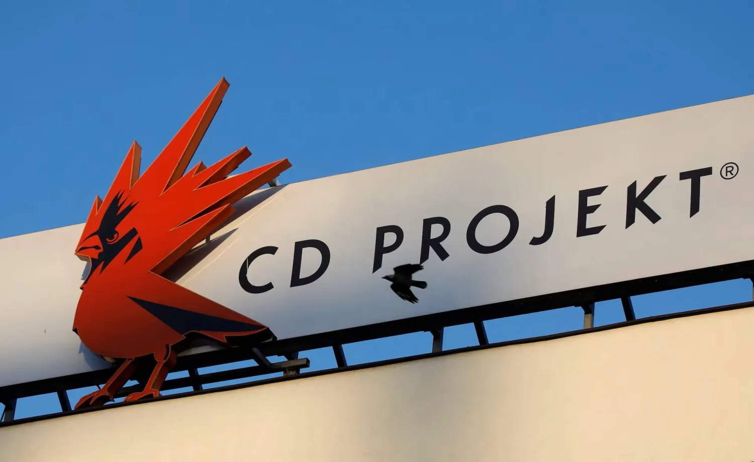A bird flies in front of the CD Projekt logo at its headquarters in Warsaw, Poland January 21, 2020. Picture taken January 21, 2020. (Reuters)