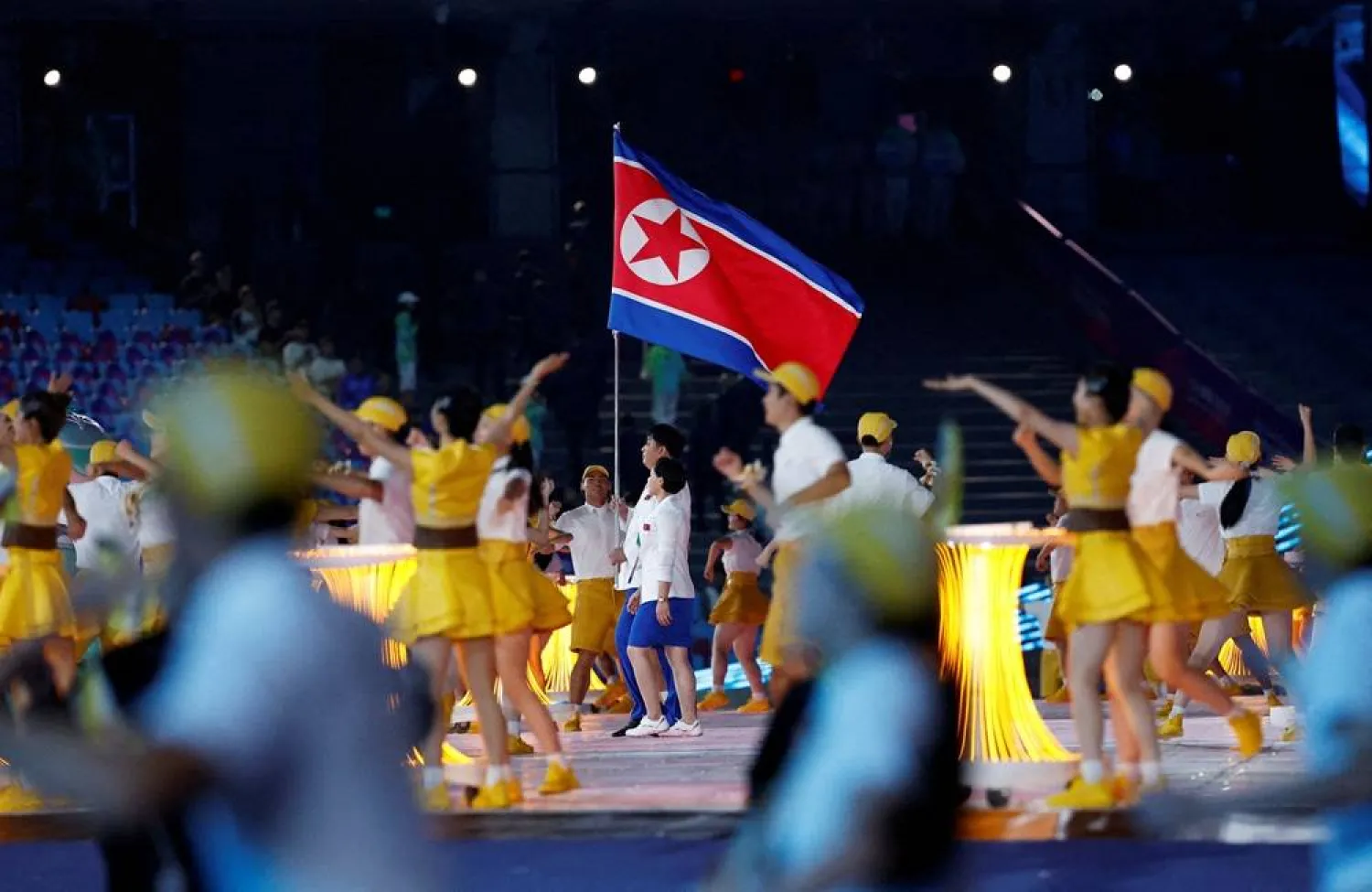 Asian Games - Hangzhou 2022 - Opening Ceremony - Hangzhou Olympic Sports Center Stadium, Hangzhou, China - September 23, 2023 Athletes from North Korea hold their national flag at the Opening Ceremony. (Reuters)