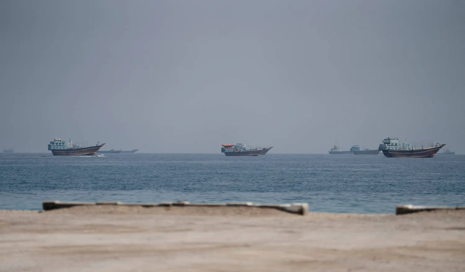 Vessels near the Strait of Hormuz, as seen from Musandam, Oman, August 24, 2026. (Reuters)