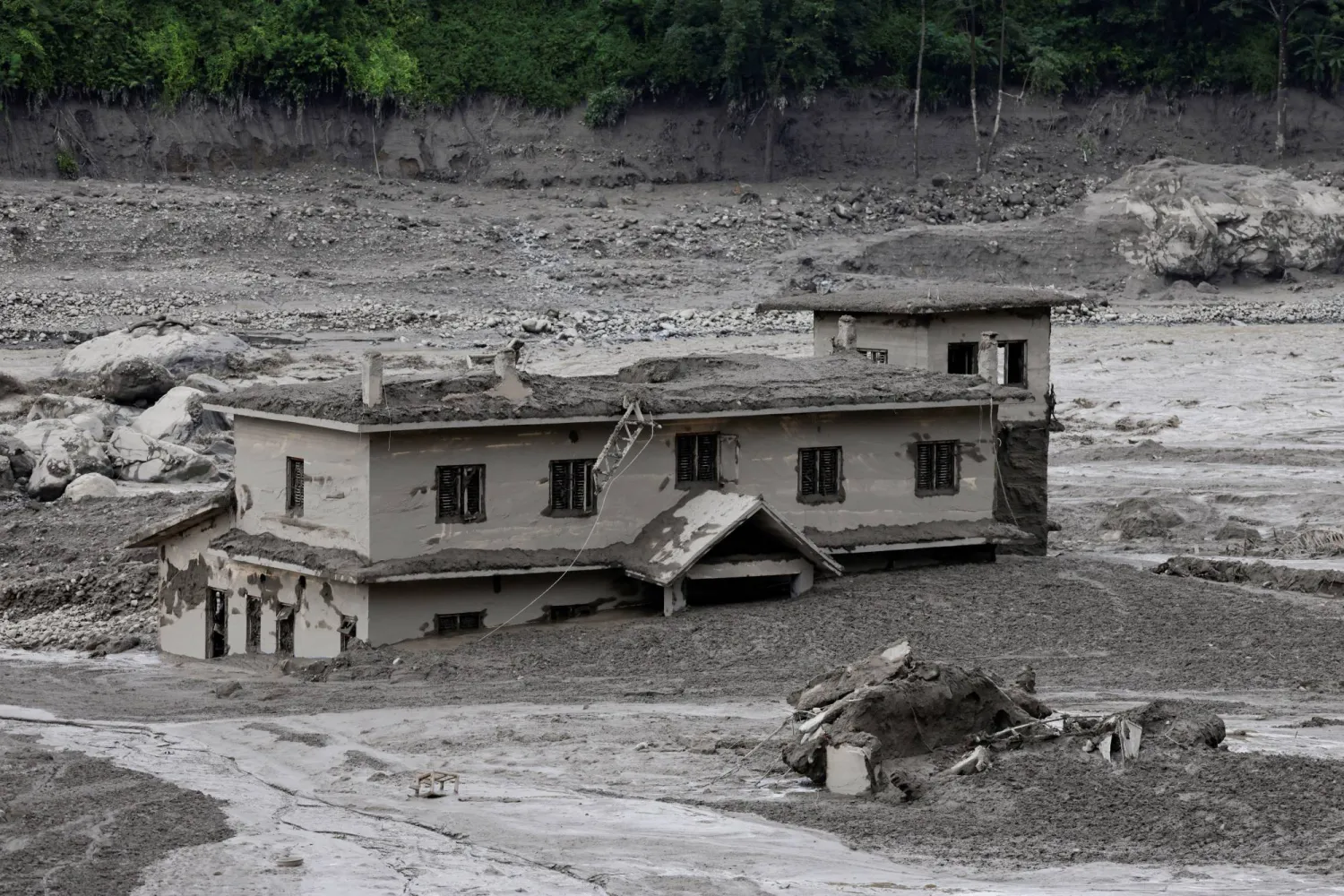 A mud-covered building following a flash flood at Trishuli in Nuwakot district, Nepal, August 26, 2026. (Reuters)