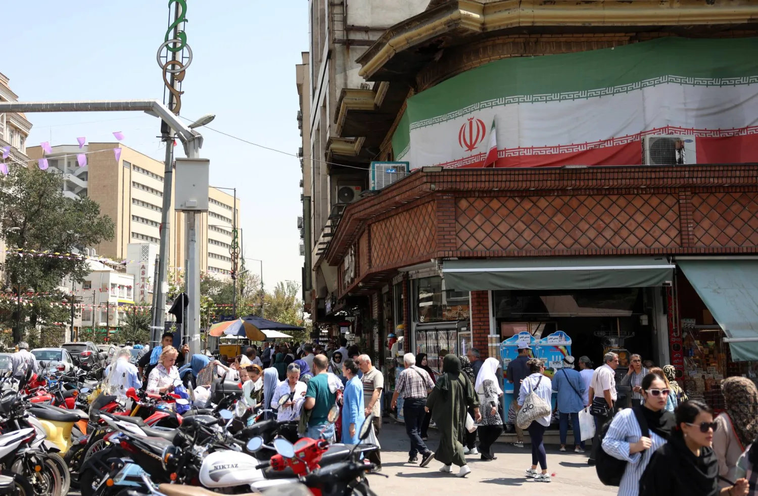 Iranians shop at a bazaar in northern Tehran, Iran, 25 August 2026. (EPA)