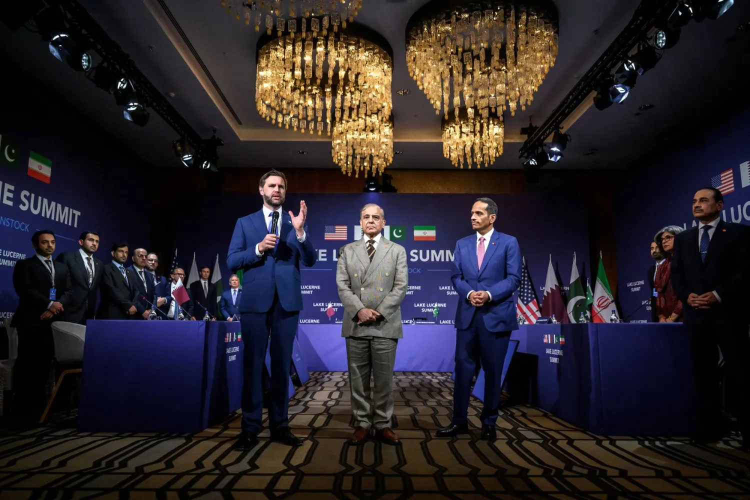 US Vice President JD Vance speaks next to Pakistan's Prime Minister Shehbaz Sharif and Qatar's Prime Minister Sheikh Mohammed bin Abdulrahman bin Jassim Al Thani at the start of a quadrilateral meeting between the United States, Iran, Pakistan and Qatar at the Burgenstock luxury hotel complex overlooking Lake Lucerne, Switzerland, on June 21, 2026.  FABRICE COFFRINI/Pool via REUTERS