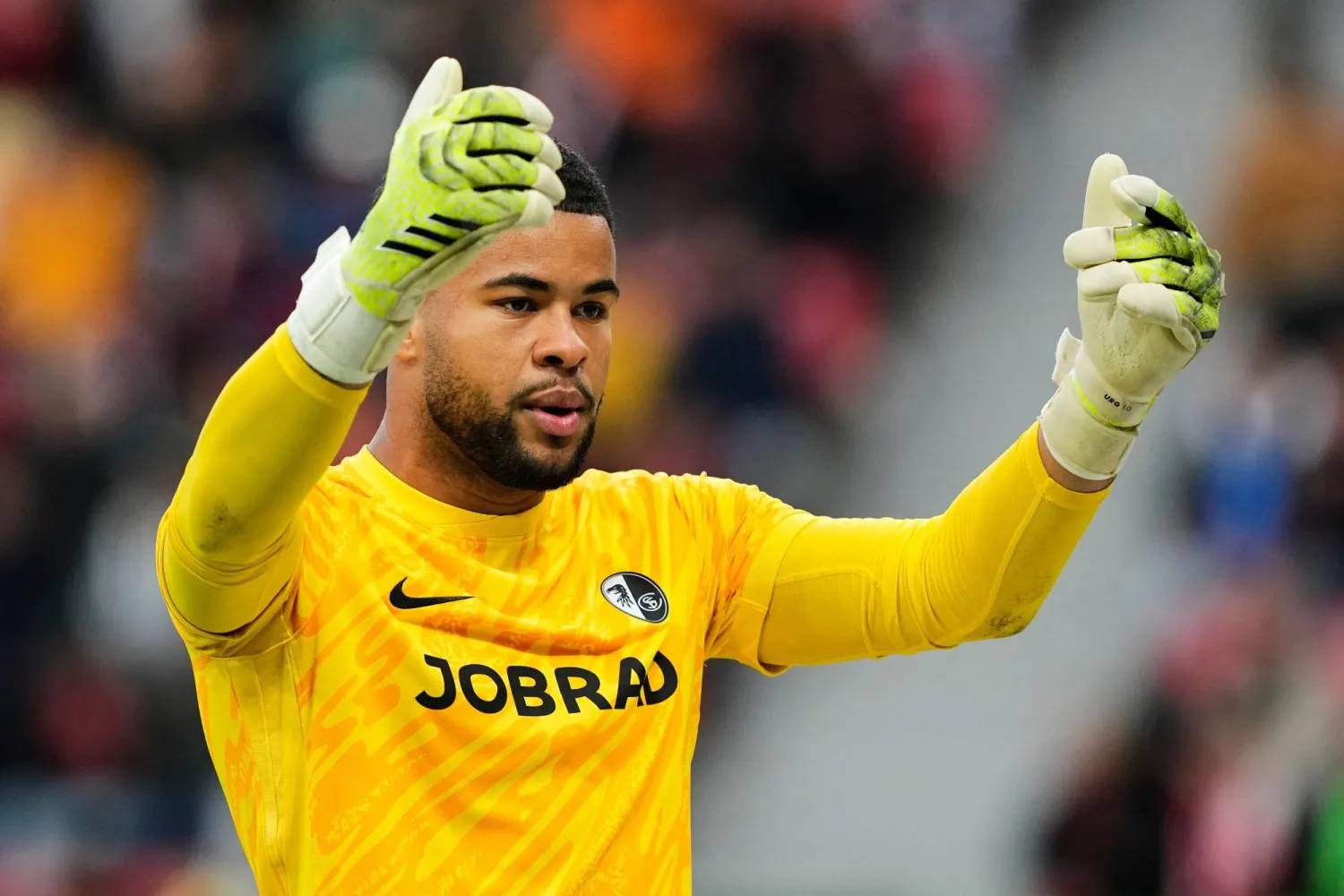 Freiburg's goalkeeper Noah Atubolu gestures during the German Bundesliga soccer match between Bayer Leverkusen and SC Freiburg in Leverkusen, Germany, on Oct. 26, 2025. (AP)