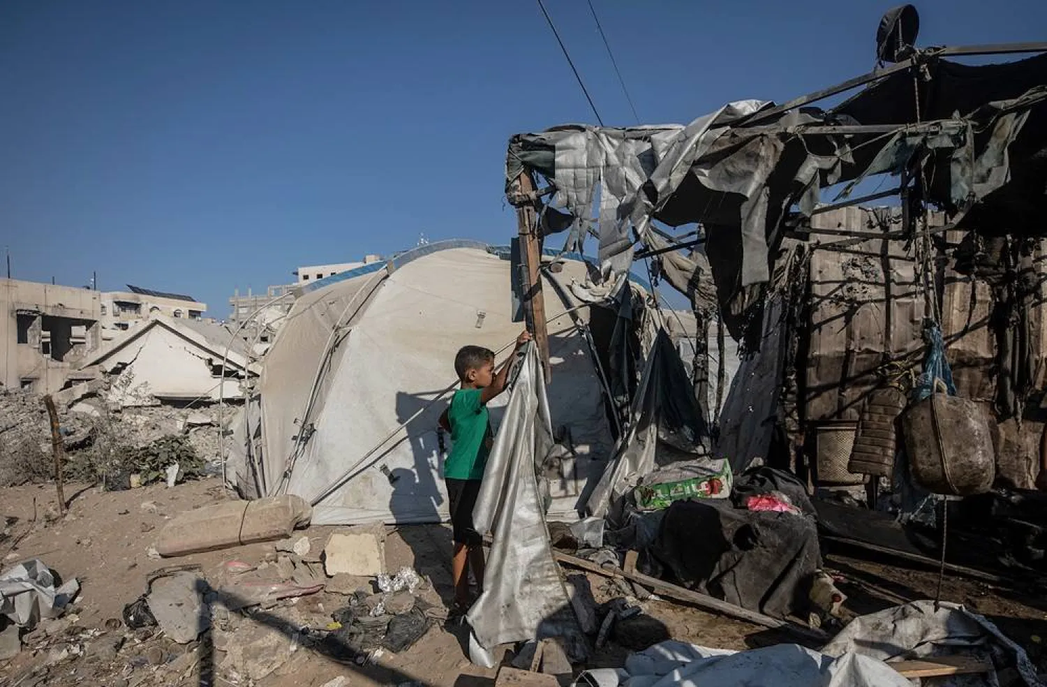 Palestinians inspect the damage following an Israeli airstrike in Gaza City, Gaza Strip, 27 August 2026. (EPA)